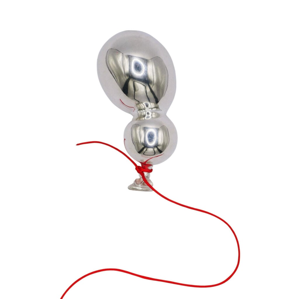 Brosche aus poliertem Silber in Form eines Ballons.